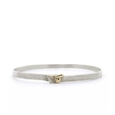solid bracelet in silver with golden detail